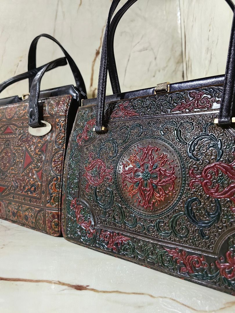 Vintage Handbag Embossed Leather Patterned (Category: Shoulder Bags) located in Tarlac. Submitted by jeremiah.curator.2026 (Listing ID 1465790398, Image 2). Description: - Vintage-style textured handbag with intricate embossed patterns - Striking multi-color design in orange, black, and red tones - Structured frame opening with secure double top handles - Spacious interior with multiple compartments for easy organization - Clean lining featuring 