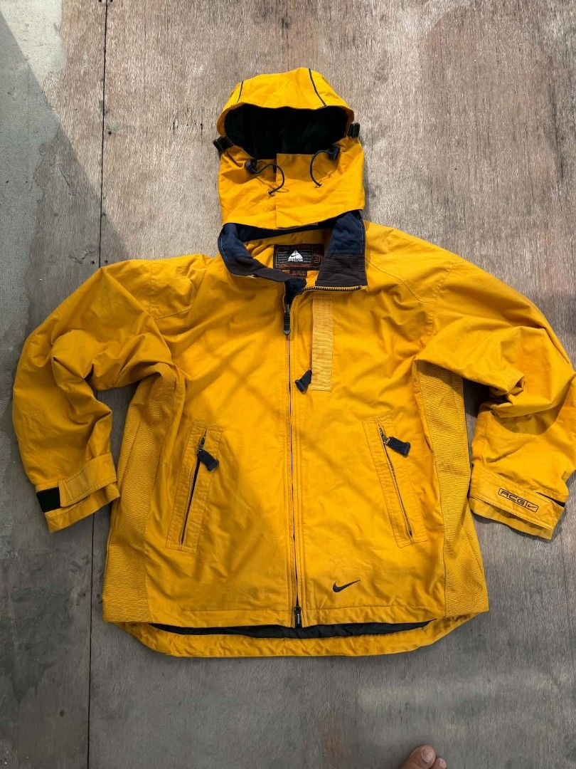 Vintage Nike ACG Yellow Outer Layer Jacket XL (Category: Coats, Jackets and Outerwear) located in Cebu City. Submitted by aksil (Listing ID 1465819649, Image 1). Description: - Brand/Style: Vintage Nike ACG Outer Layer 3 jacket - Color: Bright yellow - Size: XL - Features: Full zip front, attached hood, and secure zippered front pockets - Details: Signature Nike ACG branding on the chest, sleeve, and back collar - Material: Nylon and polyester bl