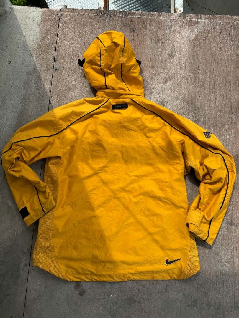 Vintage Nike ACG Yellow Outer Layer Jacket XL (Category: Coats, Jackets and Outerwear) located in Cebu City. Submitted by aksil (Listing ID 1465819649, Image 2). Description: - Brand/Style: Vintage Nike ACG Outer Layer 3 jacket - Color: Bright yellow - Size: XL - Features: Full zip front, attached hood, and secure zippered front pockets - Details: Signature Nike ACG branding on the chest, sleeve, and back collar - Material: Nylon and polyester bl
