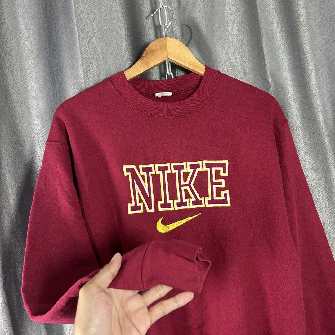 VINTAGE NIKE EMBROIDERED SWEATSHIRT (Category: Coats, Jackets and Outerwear) located in General Mariano Alvarez. Submitted by manosegunda4117 (Listing ID 1465923854, Image 2). Description: VINTAGE NIKE EMBROIDERED SWEATSHIRT Measurements: Width - 21 in Length - 26 in Colour: Maroon Excellent Condition Price : PHP 2,000 + shipping fee 📍GMA, Cavite .