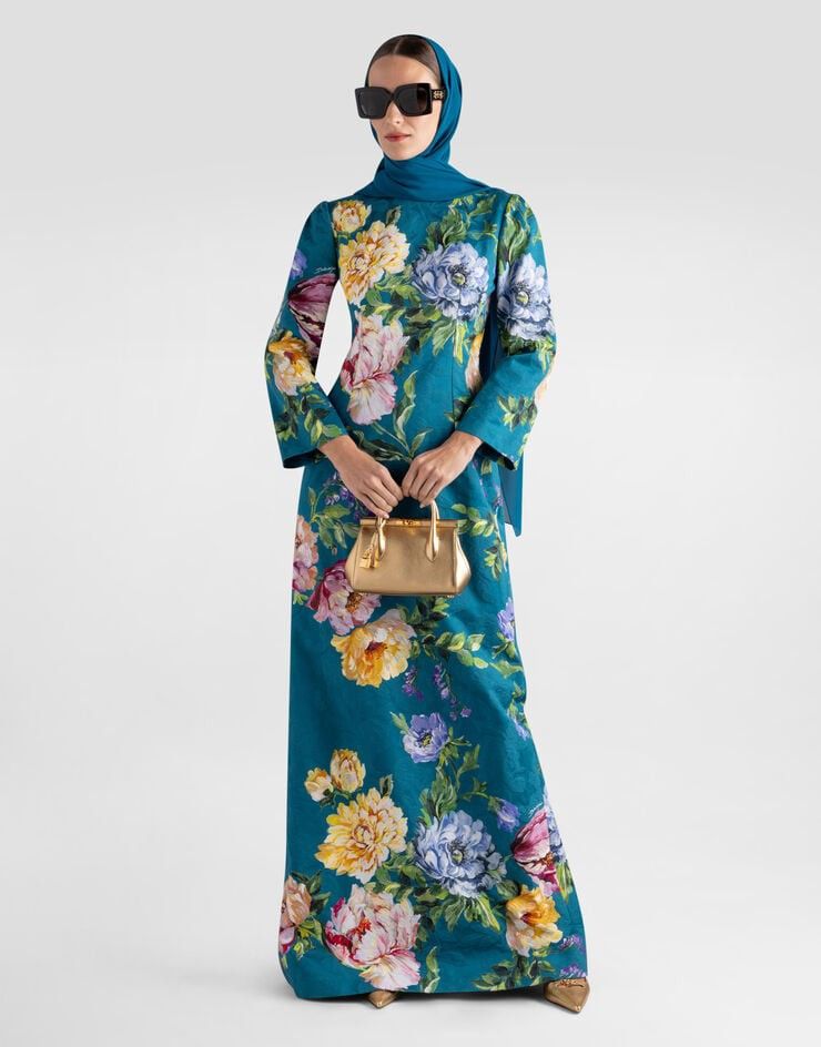 Vintage Oscar Dela Renta (Category: Dresses) located in Mandaluyong City. Submitted by miyakiko (Listing ID 1465903632, Image 1). Description: Selling vintage Oscar de la Renta silk floral kaftan / lounge dress, a signature style from the designer's sleepwear and lounger archives. It features a dark emerald green or teal base adorned with a multi-colored botanical print of roses and hydrangeas, complemented by classic gold-toned piping along the 