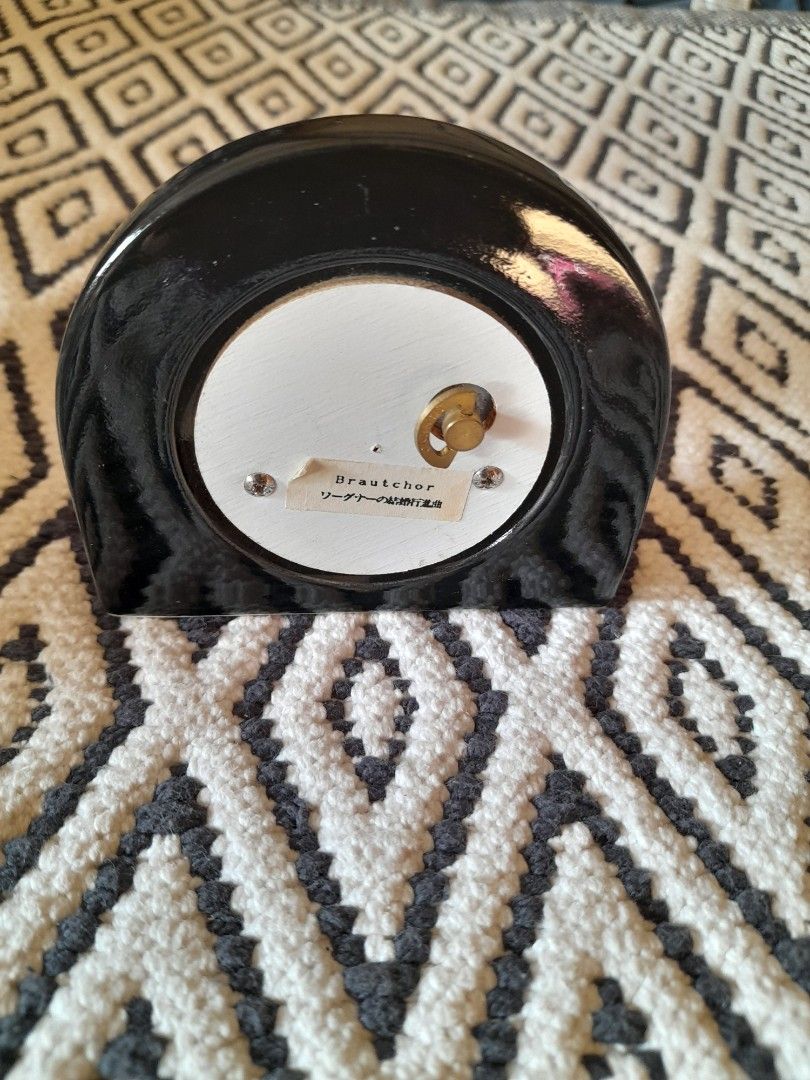Vintage Sankyo Music Box (Category: Other Home Decor) located in Bocaue. Submitted by marajapansurplus (Listing ID 1465843074, Image 2). Description: - Vintage music theater musical box - Features a fascinating visible wind-up mechanism inside - Charming music note symbol printed on the side - Classic gold-toned winding key on the back with Japanese text label - Supported by a sturdy white half-circle base at the bottom.