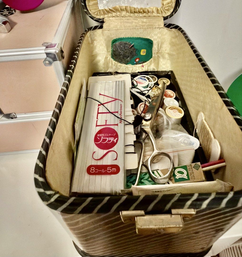 Vintage Striped Sewing Box with Contents (Category: Craft Supplies & Tools) located in Quezon City. Submitted by bdtzzz3 (Listing ID 1465800414, Image 3). Description: - Vintage black and white striped design with gold trim and white plastic handle - Includes various sewing supplies: threads, elastic tape, scissors, needles, and buttons - Lid features a built-in pincushion and handy mirror - Solid and sturdy build, perfect for organizing your sew