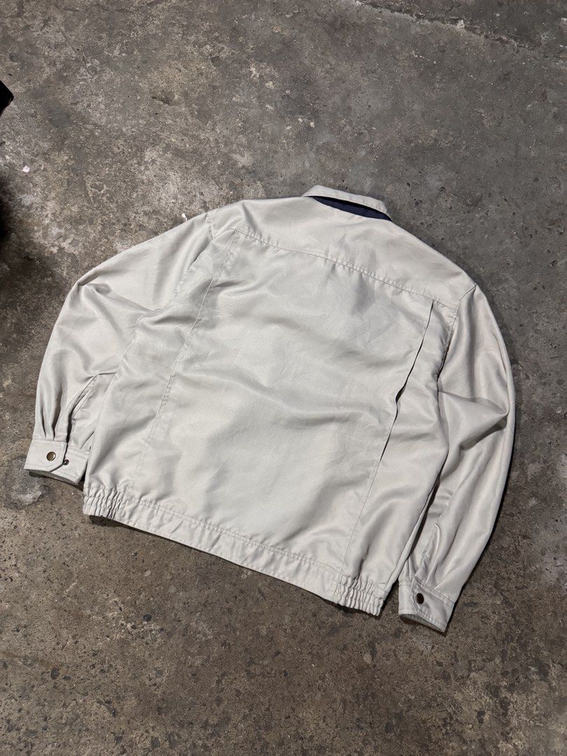 Vintage Utility Work Jacket Beige (Category: Coats, Jackets and Outerwear) located in Pasig City. Submitted by dripthrift1600 (Listing ID 1465950259, Image 2). Description: - Color: Beige - Style: Workwear jacket - Closure: Front button closure - Pockets: Buttoned chest pockets, zippered compartment, and extra sleeve pocket - Fit: Elasticated hem at the back for a relaxed fit - Condition: Clean fabric and solid hardware throughout - Dimes: 22x24.