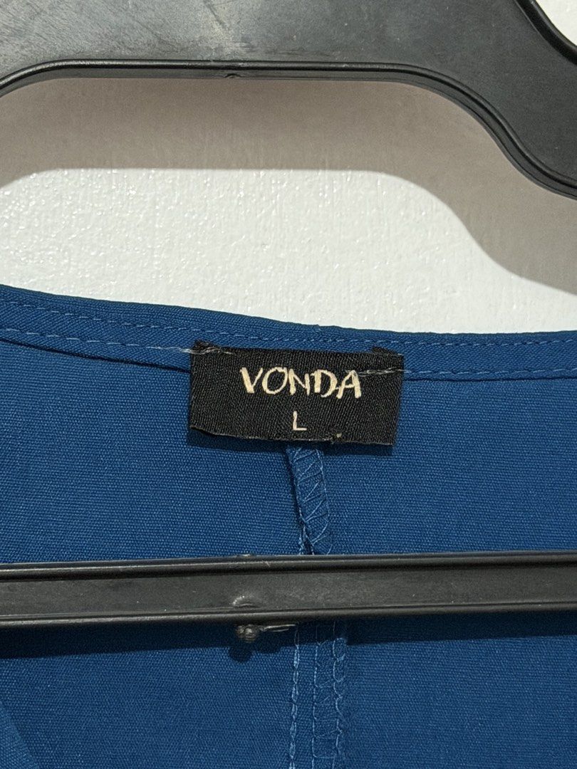 Vonda Blue Wrap Dress Size L (Category: Dresses) located in Las Pinas. Submitted by milkydeclutter (Listing ID 1465939435, Image 2). Description: - Brand/Model: Vonda blue dress - Size: Large - Style: V-neck wrap front with plain solid back - Sleeves: Short puffed sleeves - Features: Gathered elastic waistline and convenient side pockets - Material: Lightweight and easy to throw on - Perfect for: office wear.