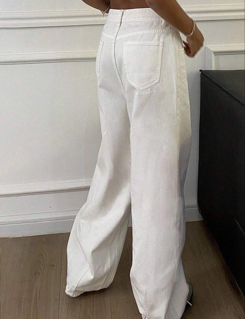 White 100% Cotton Wide Leg Jeans (Category: Jeans) located in Bulacan. Submitted by mersain (Listing ID 1465945475, Image 2). Description: - Style: White denim pants in a relaxed wide-leg fit - Material: 100% breathable, comfortable, and lightweight cotton - Rise: High-waisted with front button closure and belt loops - Pockets: Standard back pockets - Versatility: Clean neutral shade that matches everything in your wardrobe.