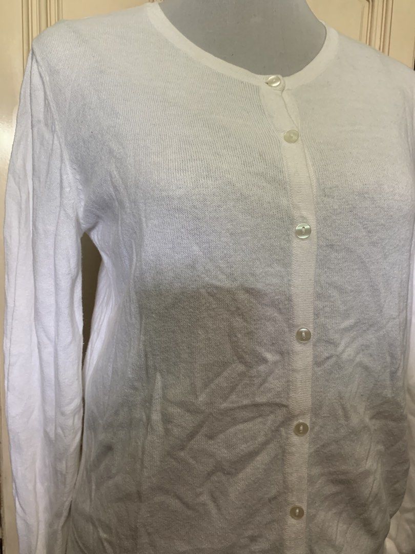 White knitted long sleeve button-up cardigan (Category: Coats, Jackets and Outerwear) located in Quezon City. Submitted by clothingline4sale (Listing ID 1465898316, Image 2). Description: White Button Down Cardigan Very good condition/ like new Stretchy/ Soft fabric/ not itchy Size: medium- semiLarge Bust: 38-44” ; Length: 23” ; Arms Circumference/ 14-18” Very nice in actual .