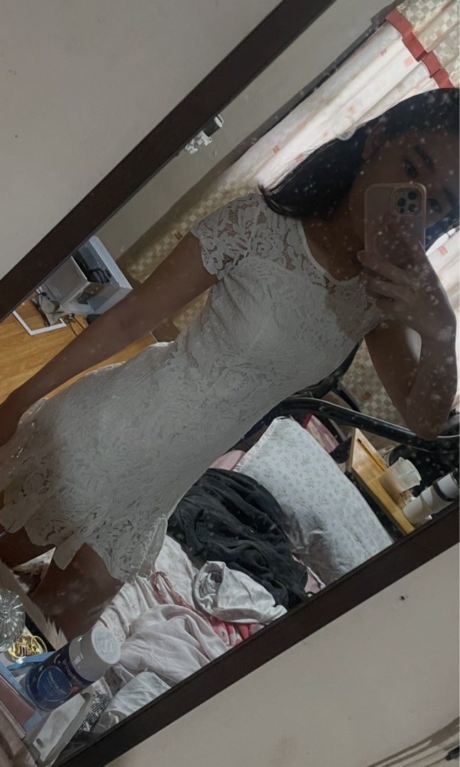 White Lace Short Sleeve Mini Dress (Category: Dresses) located in Rizal. Submitted by pikaapikadclttr (Listing ID 1463585709, Image 3). Description: - White lace mini dress - Short sleeves - Ruffled hem - Estimated Size: Small - Medium - Ideal for parties and events - Comfortable and stylish - Please check photos for condition details.