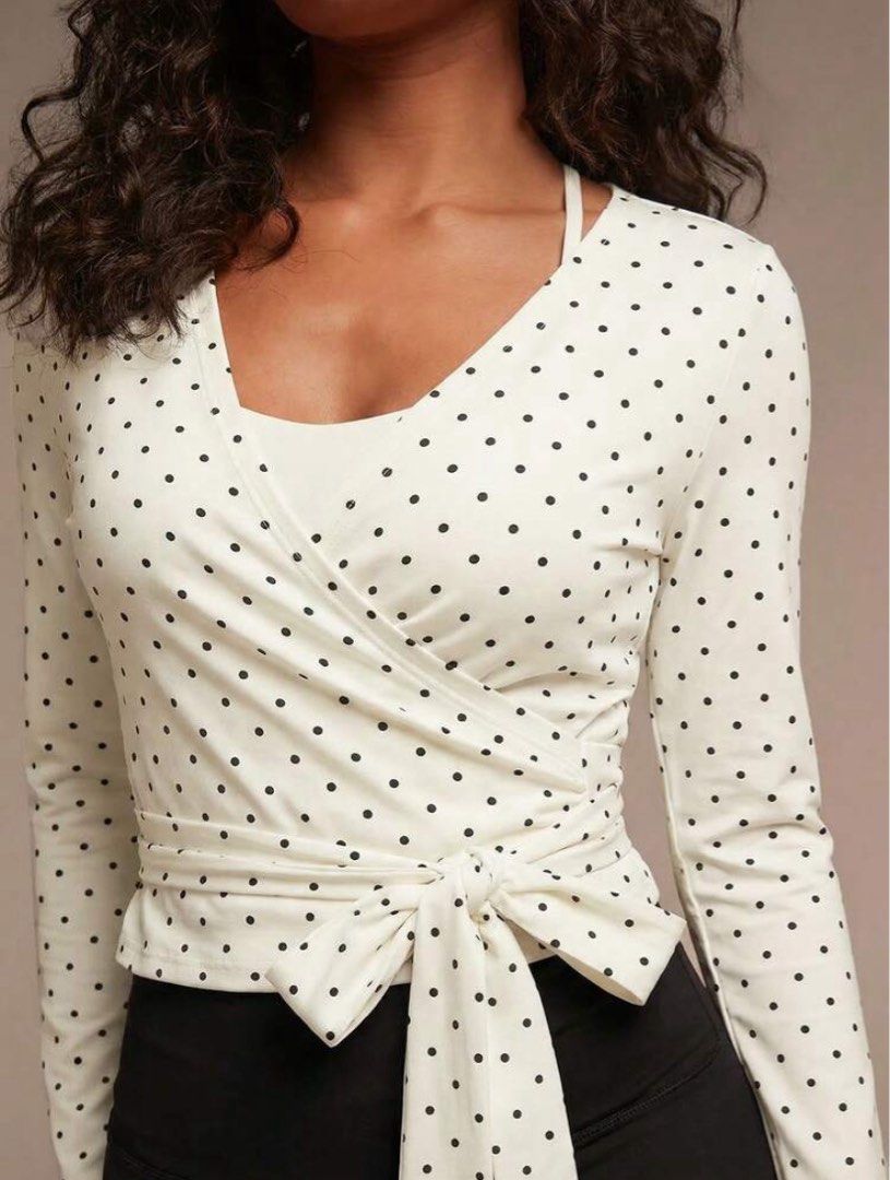 White Polka Dot Wrap Top With Waist Tie (Category: Blouses) located in Quezon City. Submitted by _dcluttering (Listing ID 1465857215, Image 2). Description: - Color/Pattern: White with all-over black polka dots - Design: Wrap-style front with built-in cami layer and matching waist tie - Features: Long sleeves with convenient thumbholes at the cuffs - Fit: Stretchy, super comfortable fabric - Condition: Great overall condition.