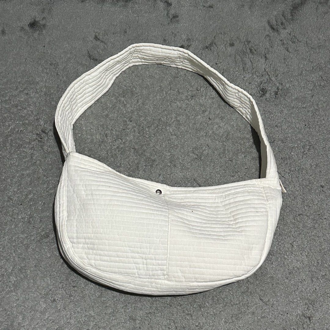 White Quilted Shoulder Bag Crescent Bag (Category: Shoulder Bags) located in Lipa City. Submitted by jecoparra (Listing ID 1465839993, Image 1). Description: - Style: Trendy curved crescent shape with stylish horizontal quilting - Color: Clean, versatile white that matches any casual outfit - Material: Soft, lightweight fabric for comfortable daily wear - Closure: Simple and secure center magnetic button - Strap: Comfortable length for effortless