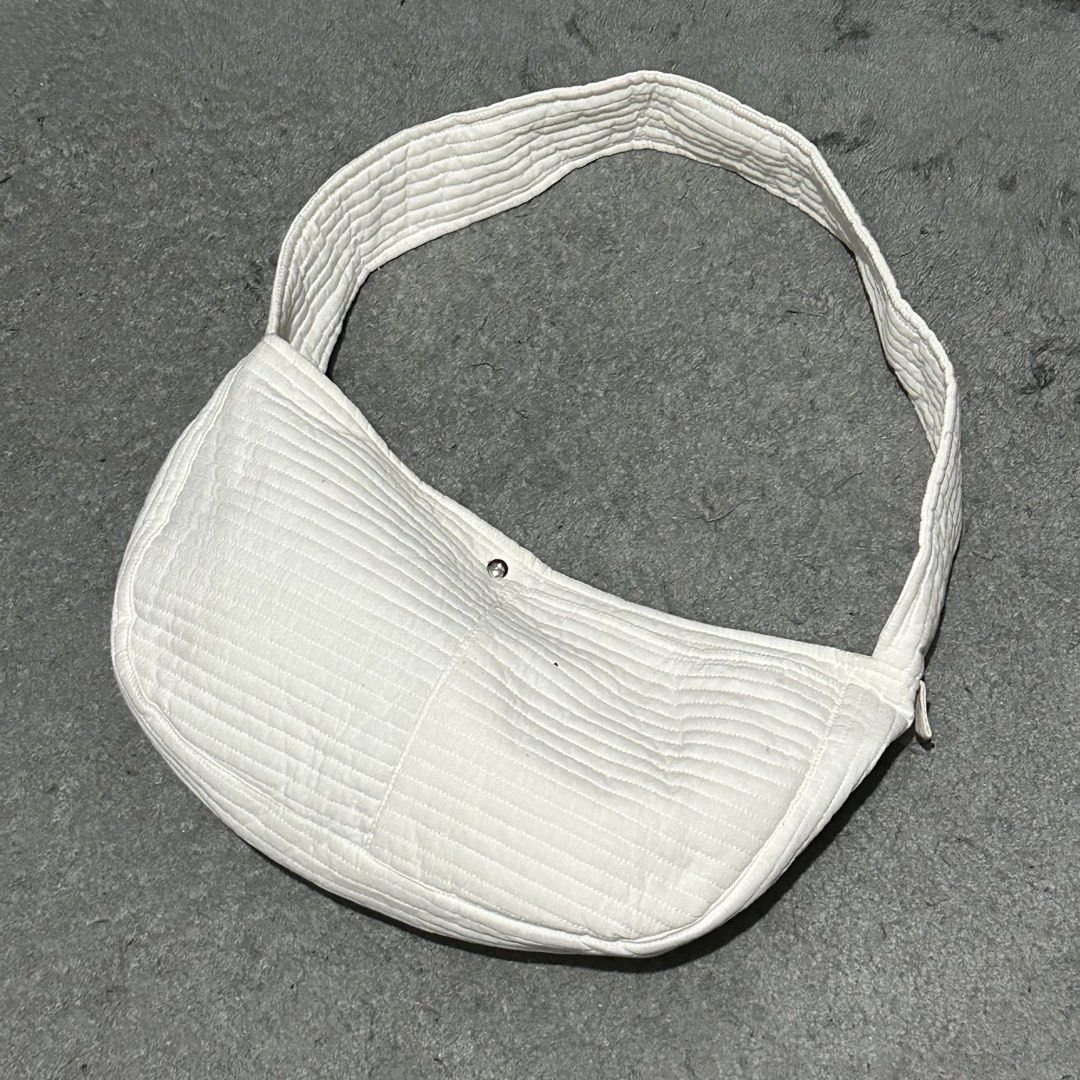 White Quilted Shoulder Bag Crescent Bag (Category: Shoulder Bags) located in Lipa City. Submitted by jecoparra (Listing ID 1465839993, Image 2). Description: - Style: Trendy curved crescent shape with stylish horizontal quilting - Color: Clean, versatile white that matches any casual outfit - Material: Soft, lightweight fabric for comfortable daily wear - Closure: Simple and secure center magnetic button - Strap: Comfortable length for effortless