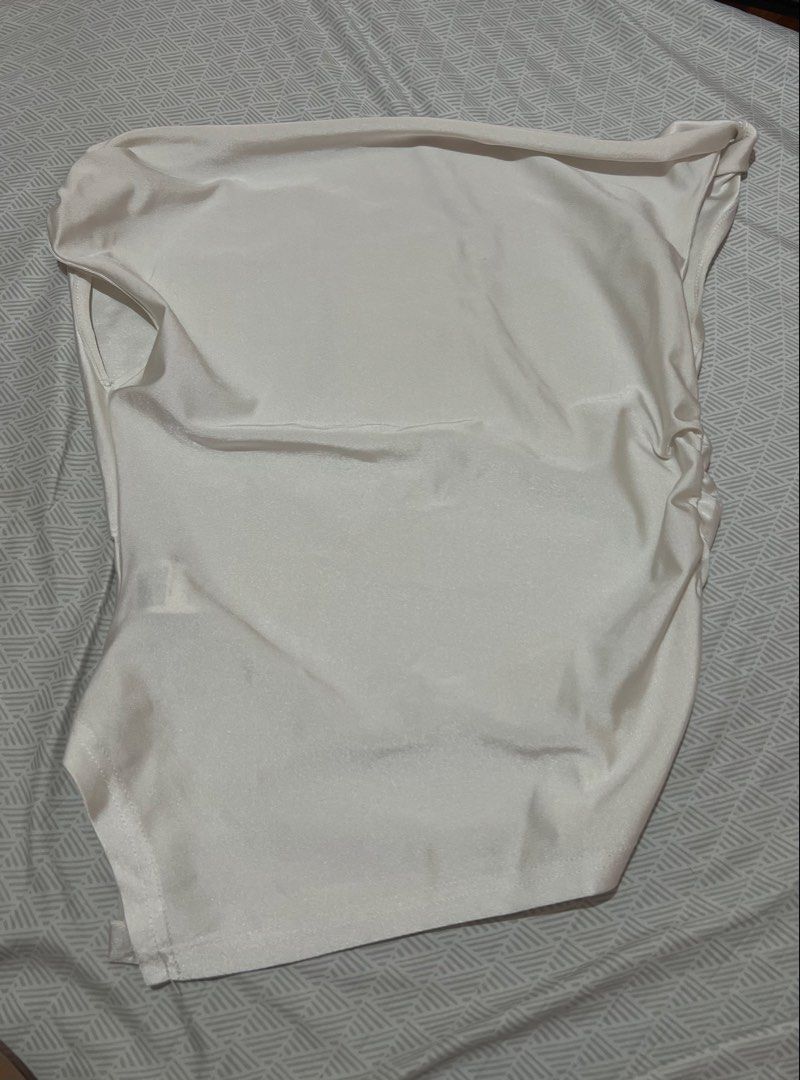 White Satin Cowl Neck Tank Top (Category: Sleeveless) located in Manila. Submitted by kaceylgt (Listing ID 1465924728, Image 1). Description: - Color: White - Material: Smooth satin with a slight sheen - Style: Sleeveless cowl neck top - Details: Chic side ruching and beautiful front drape - Versatility: Easy to dress up with a skirt or keep casual with jeans.