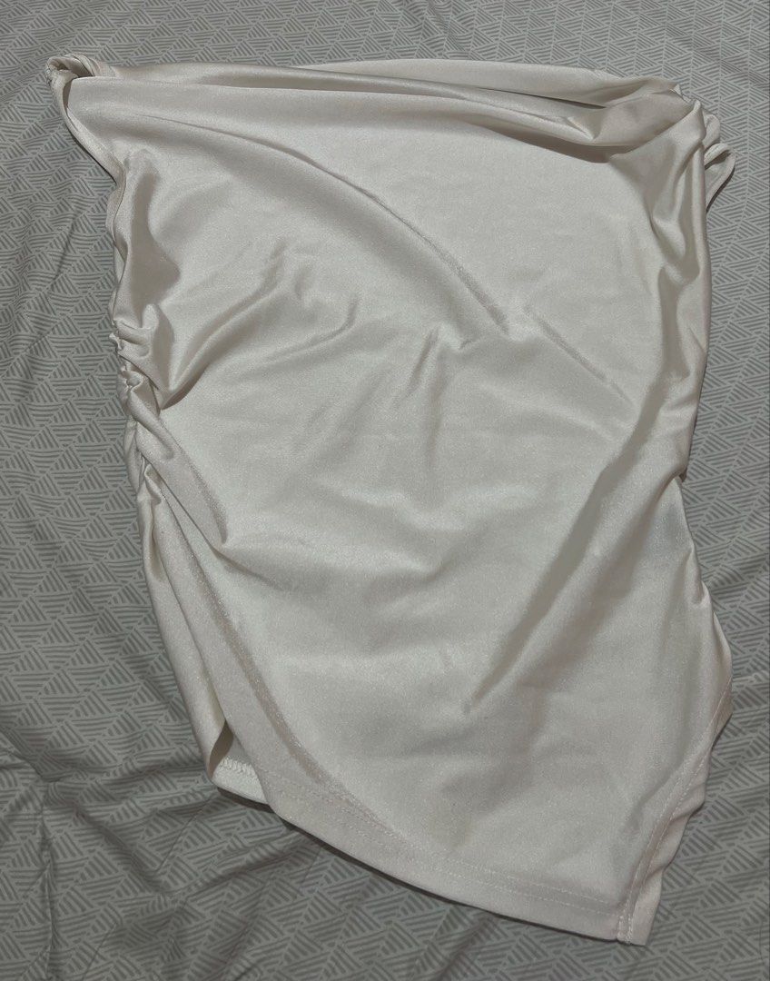 White Satin Cowl Neck Tank Top (Category: Sleeveless) located in Manila. Submitted by kaceylgt (Listing ID 1465924728, Image 2). Description: - Color: White - Material: Smooth satin with a slight sheen - Style: Sleeveless cowl neck top - Details: Chic side ruching and beautiful front drape - Versatility: Easy to dress up with a skirt or keep casual with jeans.