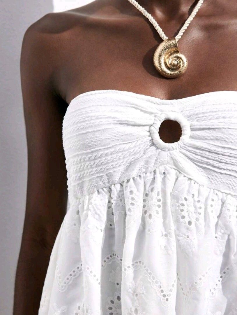 White Strapless Embroidered Mini Dress (Category: Dresses) located in Muntinlupa City. Submitted by joanfloress (Listing ID 1465910395, Image 2). Description: White Strapless Embroidered Mini Dress - Perfect for weekend markets, park dates, or beach days - Worn once only - Size small (Please refer to measurement chart in photos) RFS: Doesn't look flattering on me Can do meet up/delivery through J&T Express 📍Alabang, Muntinlupa.
