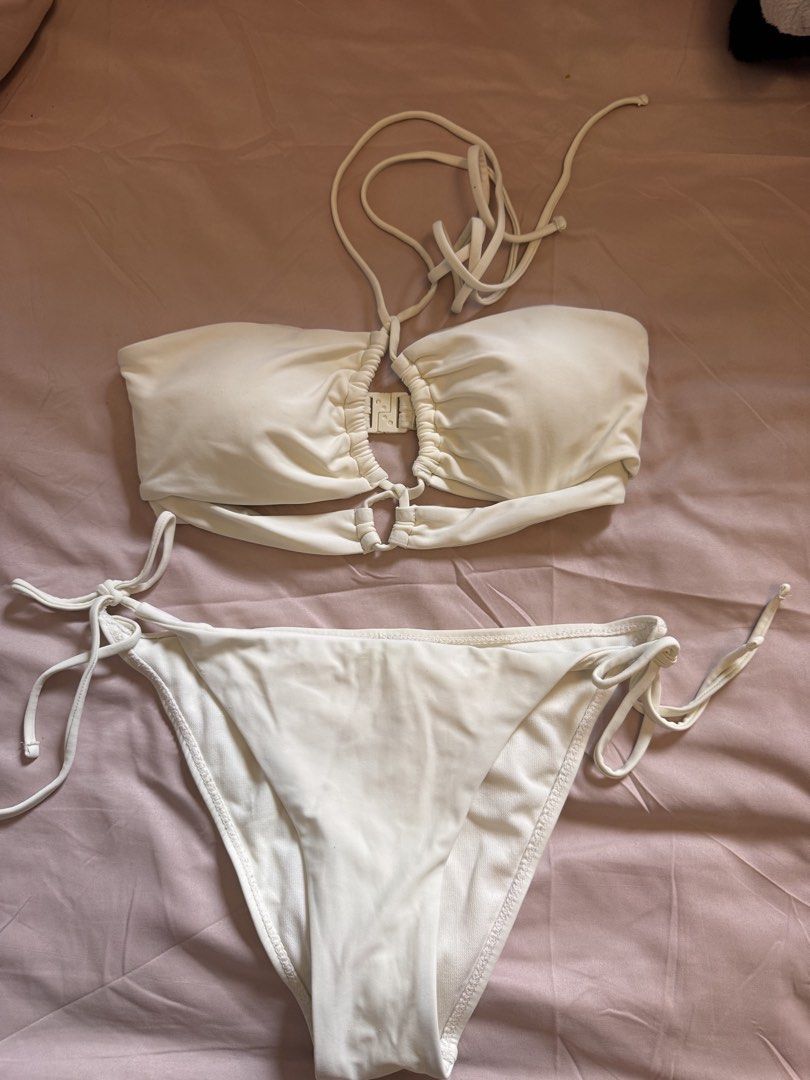 White two-piece bikini set (Category: Bikinis & Swimsuits) located in Dasmarinas. Submitted by pixiesell (Listing ID 1465785611, Image 1). Description: Two-piece bikini set in clean white. Size: Medium Used only twice..