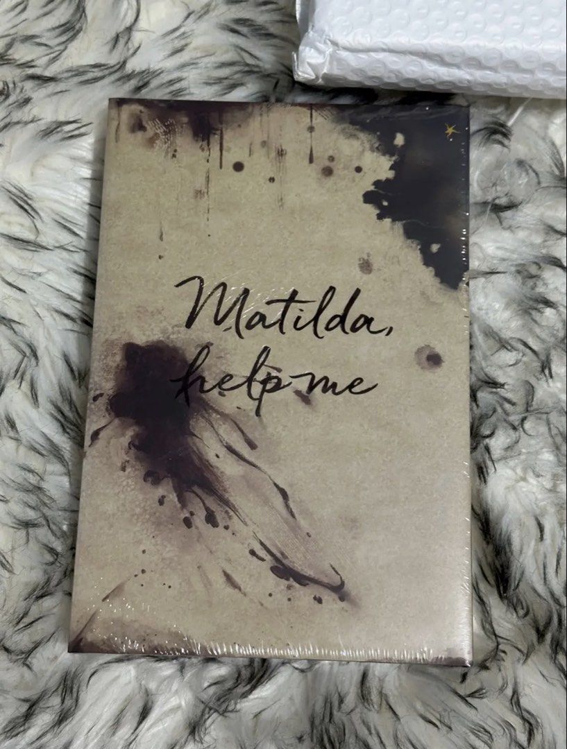 Wild Reverence (Bookish Box ) (Category: Storybooks) located in Manila. Submitted by vivi_rain (Listing ID 1465893481, Image 3). Description: - Title: Wild Reverence by Rebecca Ross - Edition: Bookish Box Edition Hardcover - Condition: Brand new, still in original plastic shrink wrap - Cover Art: Custom design with starry celestial figure and castle details - Back Cover: Handwritten text design reading "Matilda help me" - Edges: Stenciled sprayed