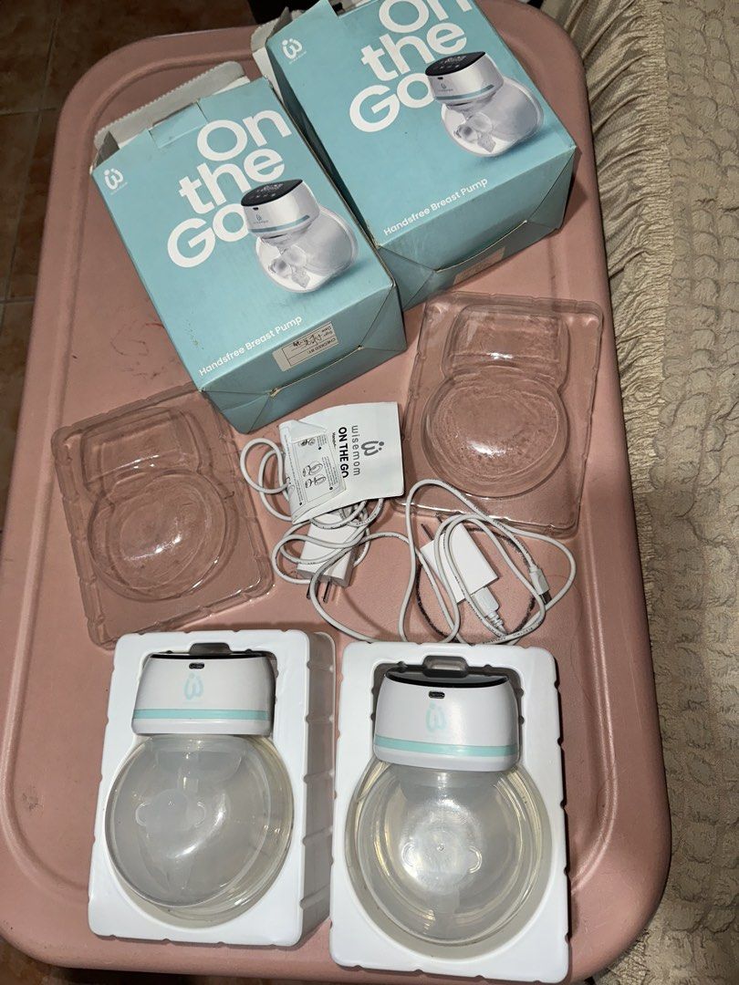 Wisemom On The Go Handsfree Breast Pump Double Set (Category: Breastfeeding & Bottle Feeding) located in Antipolo. Submitted by jhayniejhulia (Listing ID 1465769577, Image 2). Description: - Brand: Wisemom - Item: On The Go Handsfree Breast Pump Set - Included: 2 pump units, charger cables, straps, manuals, and original packaging boxes - Design: Wearable, cordless, and tubeless for ultimate convenience - Perfect for: Multitasking easily while wor