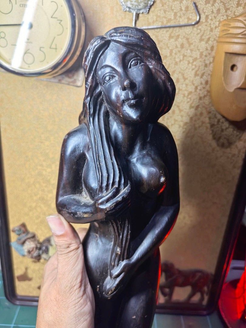 Wood Carving Figurine - Solid Heavy Wood (Category: Other Home Decor) located in Cebu City. Submitted by dudes_villanueva (Listing ID 1465912706, Image 3). Description: Wood Carving Figurine - Woman 📌 Dark-stained or hardwood carved female figure standing on a rectangular wooden block base, with smooth flowing hair and hands held near the front. 📌 In excellent condition. Exact age and reference not found. Possible Vintage or older. 📌 Solid hea