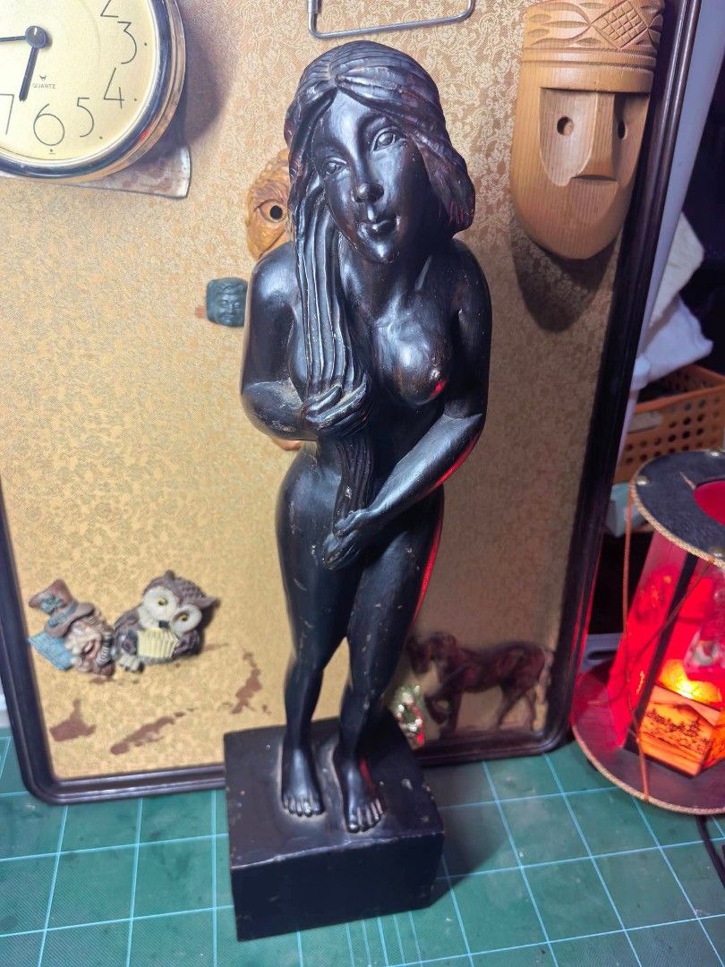 Wood Carving Figurine - Solid Heavy Wood (Category: Other Home Decor) located in Cebu City. Submitted by dudes_villanueva (Listing ID 1465912706, Image 2). Description: Wood Carving Figurine - Woman 📌 Dark-stained or hardwood carved female figure standing on a rectangular wooden block base, with smooth flowing hair and hands held near the front. 📌 In excellent condition. Exact age and reference not found. Possible Vintage or older. 📌 Solid hea