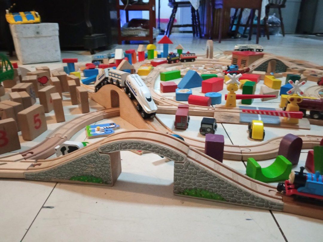 Wooden Train Track Set with Trains and Blocks (Category: Educational & Learning Toys) located in Quezon City. Submitted by luckyus123 (Listing ID 1465809173, Image 2). Description: - Massive wooden train track set for hours of fun - Includes wooden tracks, bridges, and buildings - Comes with toy trains like Thomas the Tank Engine - Includes colourful wooden blocks, animal tiles, and vehicles - Lots of pieces to build a huge railway layout.