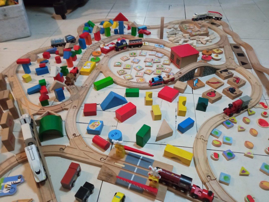 Wooden Train Track Set with Trains and Blocks (Category: Educational & Learning Toys) located in Quezon City. Submitted by luckyus123 (Listing ID 1465809173, Image 1). Description: - Massive wooden train track set for hours of fun - Includes wooden tracks, bridges, and buildings - Comes with toy trains like Thomas the Tank Engine - Includes colourful wooden blocks, animal tiles, and vehicles - Lots of pieces to build a huge railway layout.