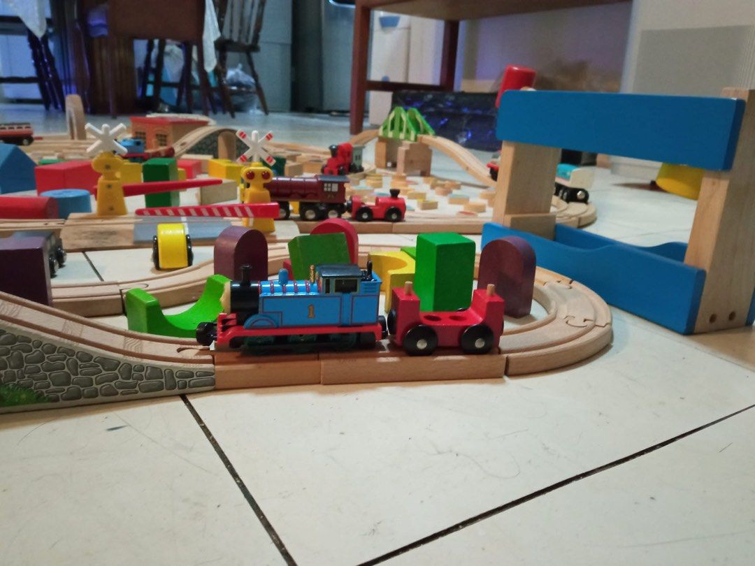 Wooden Train Track Set with Trains and Blocks (Category: Educational & Learning Toys) located in Quezon City. Submitted by luckyus123 (Listing ID 1465809173, Image 3). Description: - Massive wooden train track set for hours of fun - Includes wooden tracks, bridges, and buildings - Comes with toy trains like Thomas the Tank Engine - Includes colourful wooden blocks, animal tiles, and vehicles - Lots of pieces to build a huge railway layout.