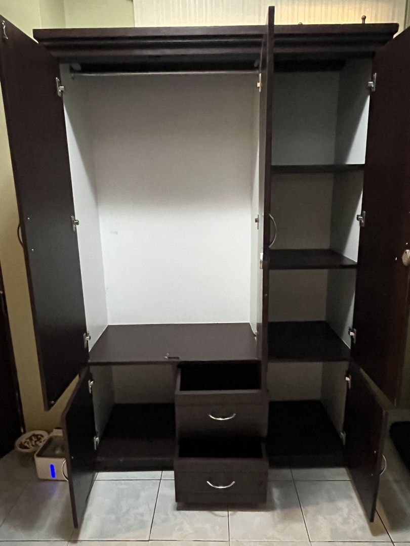 Wooden Wardrobe Cabinet (Category: Shelves, Cabinets & Racks) located in Dasmarinas. Submitted by stalirez (Listing ID 1465903663, Image 3). Description: Solid wood in good condition dimensions: H - 183cm L - 122cm W - 46cm Negotiable for sure buyers RFS: moved to a new house, hindi na po kasya sa room delivery: pick up or buyer-arranged courier.
