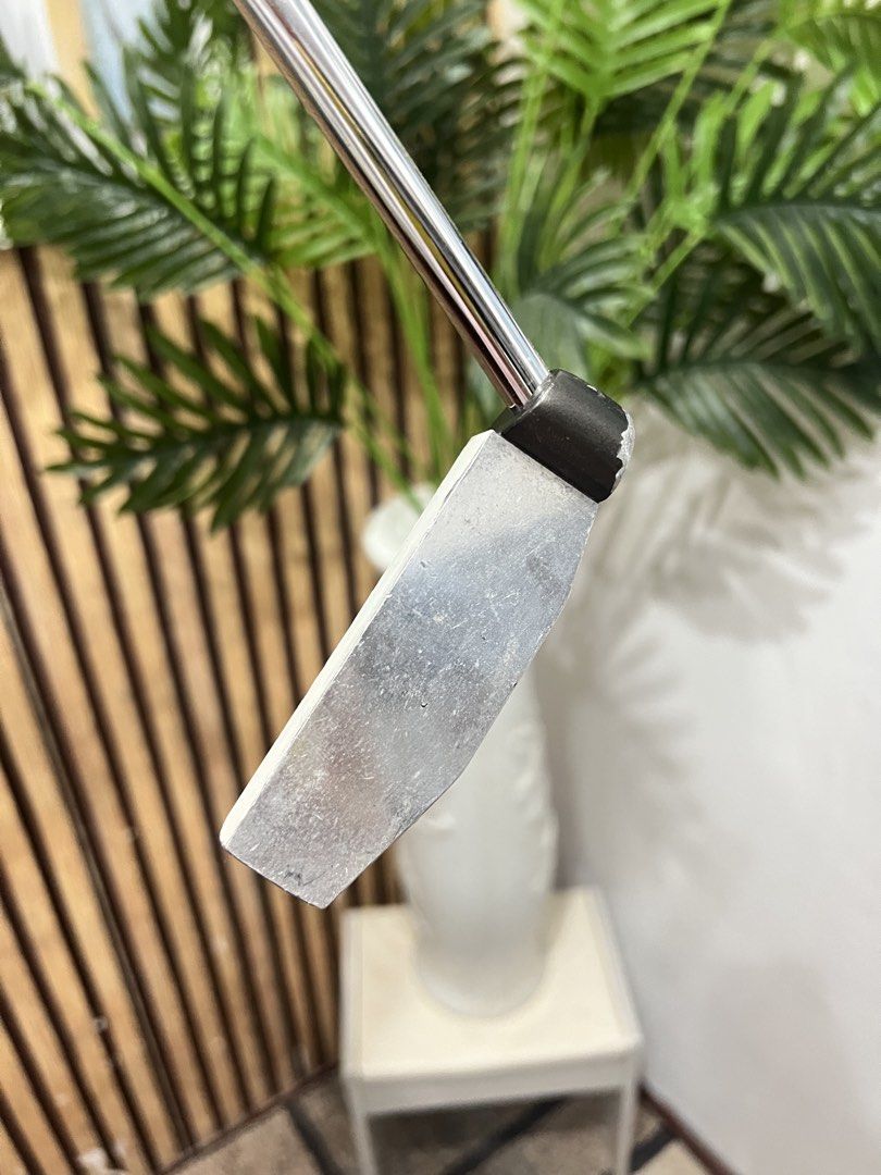 Woss Design MO-02 Putter (Category: Golf) located in Manila. Submitted by livefish.26c802 (Listing ID 1465879529, Image 3). Description: Woss Design MO-02 golf putter. Made in Japan. Classic mallet style head with distinct alignment markings on the sole. Original black Woss grip attached. Shaft includes the original branding sticker. Standard steel shaft in good shape. Clubhead shows normal wear from previous rounds on the course. Ready for the n