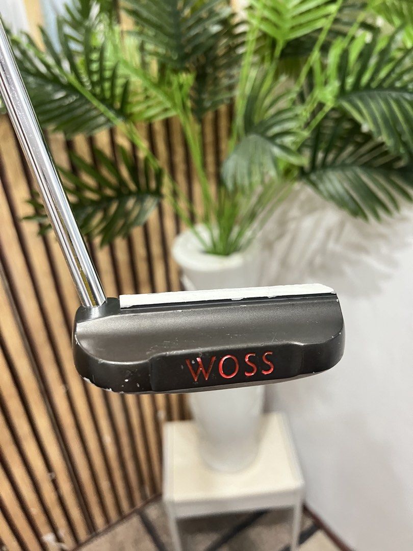 Woss Design MO-02 Putter (Category: Golf) located in Manila. Submitted by livefish.26c802 (Listing ID 1465879529, Image 2). Description: Woss Design MO-02 golf putter. Made in Japan. Classic mallet style head with distinct alignment markings on the sole. Original black Woss grip attached. Shaft includes the original branding sticker. Standard steel shaft in good shape. Clubhead shows normal wear from previous rounds on the course. Ready for the n