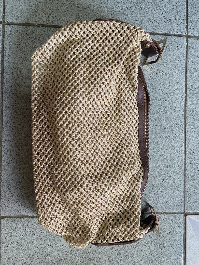 Woven Straw Handbag with Brown Leather Trim and Strap (Category: Shoulder Bags) located in Silang. Submitted by Apple_Mac07 (Listing ID 1465843321, Image 1). Description: - Style: Summer woven straw shoulder bag - Color: Beige with brown synthetic leather trim - Closure: Secure top zipper - Interior: Gold fabric lining with a convenient zippered inner pocket - Includes brown adjustable strap inside - Features: Lightweight, spacious, and perfect f