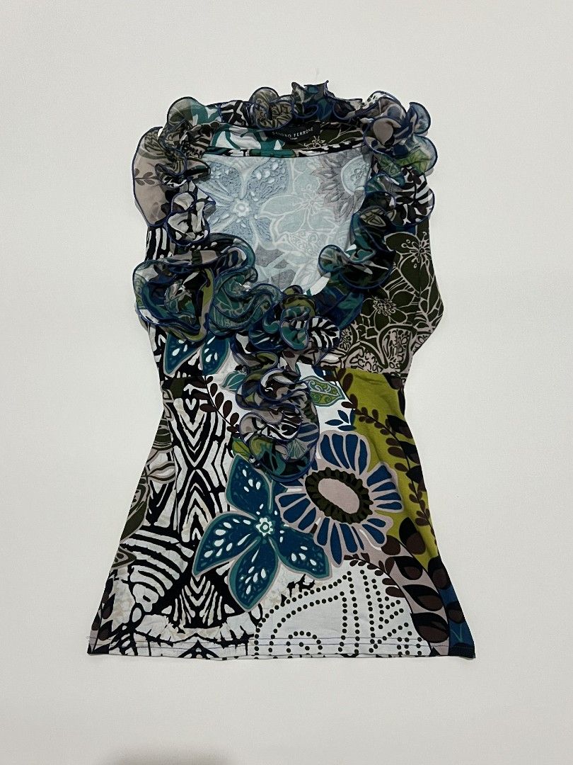 Y2k 2000s Sandro Ferrone Roma Floral Ruffle Top (Category: Sleeveless) located in Kidapawan. Submitted by rav.rose (Listing ID 1465942518, Image 1). Description: - Brand: Sandro Ferrone Roma - Design: Bold mixed floral pattern in blues, greens, and neutrals - Detail: Dramatic ruffled collar trimmed with chic blue piping - Cut: Sleeveless - Condition: Excellent, authentic fabric label intact - Style Tip: Great for pairing with slacks or skirts for