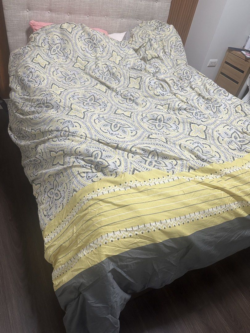 Yellow and grey paisley patterned duvet cover (Category: Bedding & Towels) located in Quezon City. Submitted by mylesenriquezstuff (Listing ID 1465879768, Image 1). Description: - Size: Fits double bed - Design: Yellow and grey paisley print with reversible solid grey bottom border and yellow accent stripe - Inclusions: Includes matching pillow shams - Material: Soft, machine-washable cotton - Condition: Clean and ready for use - Convenience: Eas