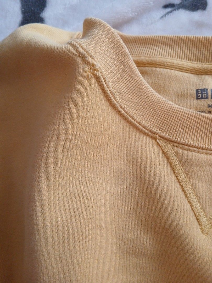 Yellow Crewneck Sweatshirt (Category: Coats, Jackets and Outerwear) located in Muntinlupa City. Submitted by kaelakuneho (Listing ID 1465795342, Image 3). Description: - Color: Bright mustard yellow - Fit: Relaxed, oversized - Design: Classic crewneck with V-stitch detail - Details: Ribbed cuffs and hem - Condition: Like new/Excellent quality - Perfect for daily casual wear - Flaws: Collar Stitching.