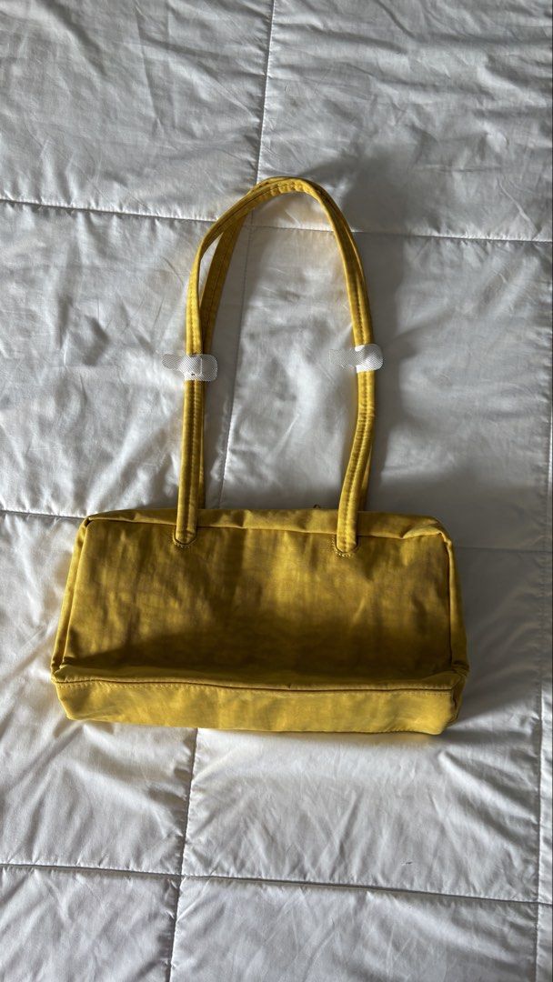 Baggu Nylon Shoulder Bag (Category: Shoulder Bags) located in Quezon City. Submitted by lea.dc (Listing ID 1465820257, Image 3). Description: BAGGU- Nylon Bowler Bag -Bought from Certified Calm Store - Brand New, Not used. -Original Price: P4,450 - Color: Sunflower - Rfs: Bought another color in Caper. *Shipping fee c/o buyer .