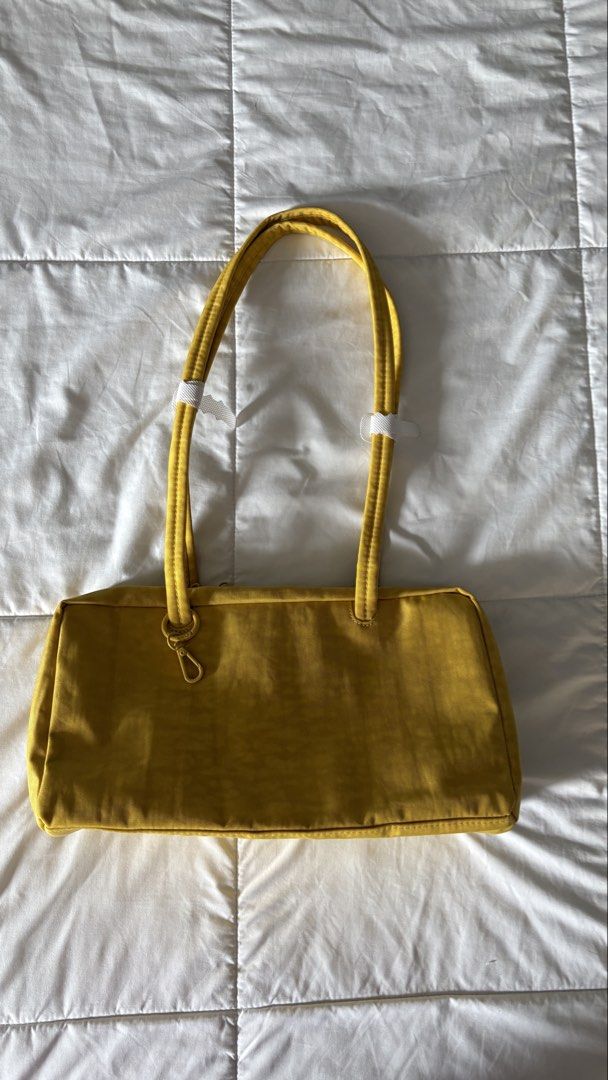 Baggu Nylon Shoulder Bag (Category: Shoulder Bags) located in Quezon City. Submitted by lea.dc (Listing ID 1465820257, Image 2). Description: BAGGU- Nylon Bowler Bag -Bought from Certified Calm Store - Brand New, Not used. -Original Price: P4,450 - Color: Sunflower - Rfs: Bought another color in Caper. *Shipping fee c/o buyer .