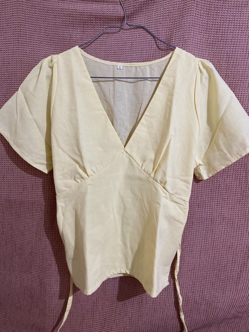 Yellow V-Neck Short Sleeve Tie-Back Blouse (Category: Blouses) located in Tarlac. Submitted by declutteredbyglai (Listing ID 1465837987, Image 1). Description: Design: Short sleeves, deep V-neck, adjustable tie-back waist detail.