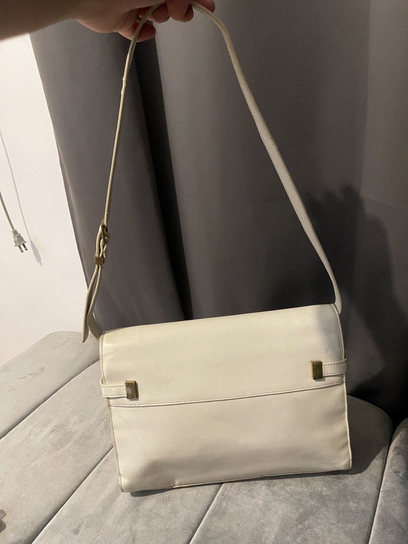 YVES SAINT LAURENT MANHATTAN BAG (Category: Luxury Bags & Wallets) located in Tarlac. Submitted by wowsinigangmix (Listing ID 1465890093, Image 2). Description: YVES SAINT LAURENT MANHATTAN BAG WHITE / GOLD HARDWARE WITH STRAP W 8 x H 11 x 21/2” D 11-14” Strap Drop ISSUES: LEATHER STRAP CREASE & GOLD CLOSURE TARNISH/SCRATCHES, YELLOWING & LEATHER MARKS, NO DUST BAG. BOUGHT ONLINE, AUTH NOT GUARANTEED. NEEDS BAG SPA/CLEANING DUE TO STORAGE. PLEASE