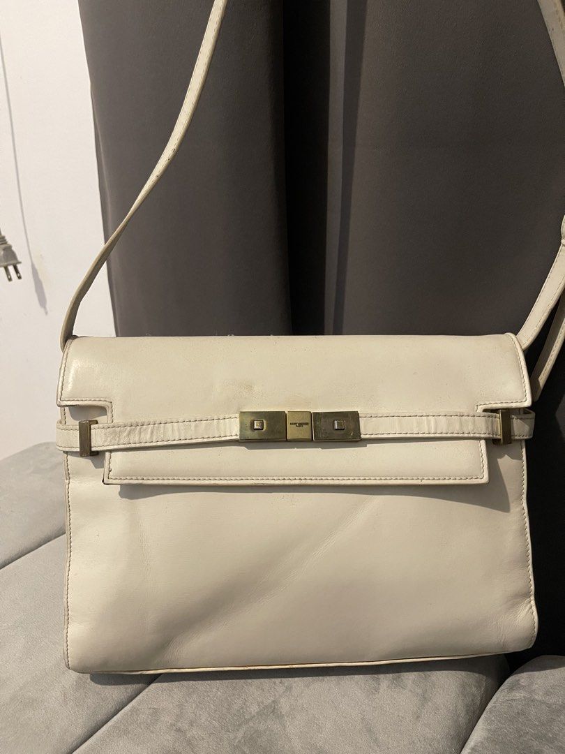 YVES SAINT LAURENT MANHATTAN BAG (Category: Luxury Bags & Wallets) located in Tarlac. Submitted by wowsinigangmix (Listing ID 1465890093, Image 1). Description: YVES SAINT LAURENT MANHATTAN BAG WHITE / GOLD HARDWARE WITH STRAP W 8 x H 11 x 21/2” D 11-14” Strap Drop ISSUES: LEATHER STRAP CREASE & GOLD CLOSURE TARNISH/SCRATCHES, YELLOWING & LEATHER MARKS, NO DUST BAG. BOUGHT ONLINE, AUTH NOT GUARANTEED. NEEDS BAG SPA/CLEANING DUE TO STORAGE. PLEASE