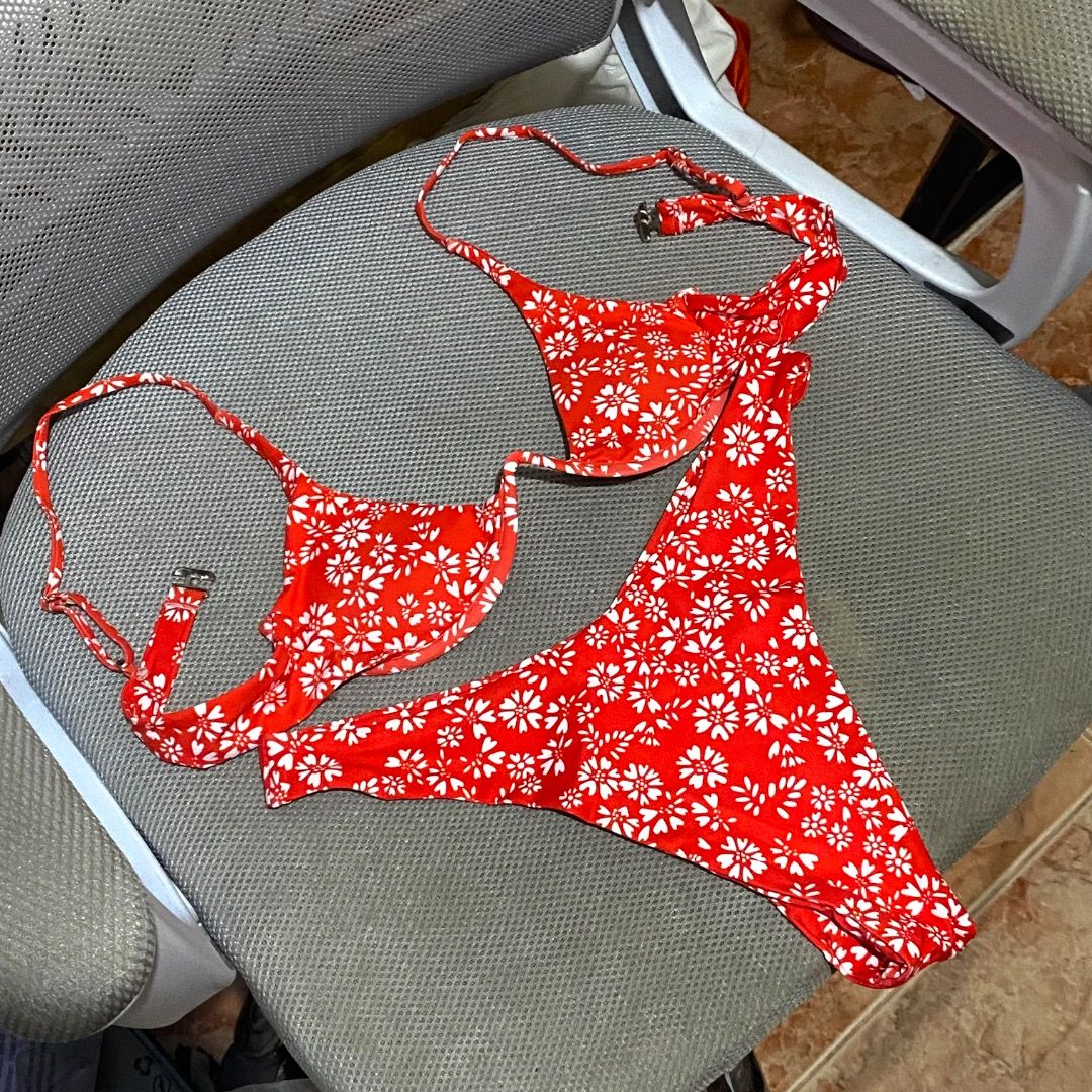 Zafu Floral Bikini (Category: Bikinis & Swimsuits) located in Antipolo. Submitted by annedeclutterss (Listing ID 1465891506, Image 1). Description: - Brand: Zaful - Small to Medium frame - Style: Bright red bikini set with all-over white floral print - Support: Built-in underwire in top cups - Fit: Adjustable back straps for a custom fit.