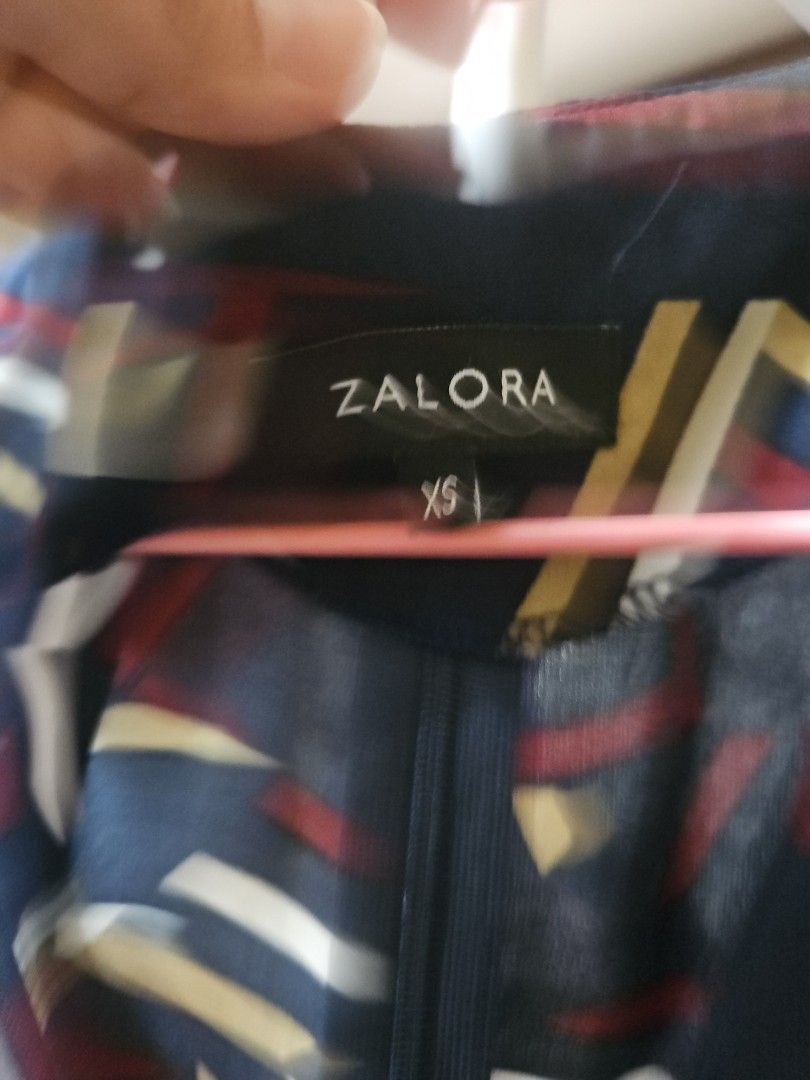 Zalora abstract printed dress size XS (Category: Dresses) located in Calamba. Submitted by handpickedbynetty (Listing ID 1465831742, Image 2). Description: - Brand: Zalora - Size: XS - Color: Dark navy blue base with white, yellow, and red abstract geometric stripes - Style: Mini dress with short puff sleeves and V-neckline - Closure: Back zipper - Material: Lightweight and easy to wear - Condition: Excellent, ready to ship!.