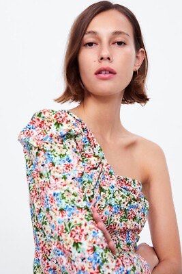 ZARA - Asymmetric Floral Print Top (Category: Longsleeves) located in Cebu City. Submitted by bnta.bnta (Listing ID 1465844261, Image 3). Description: Zara Asymmetric Floral Print Top featuring a one-shoulder design, a long sleeve on one side, and a vibrant multicolored floral pattern..