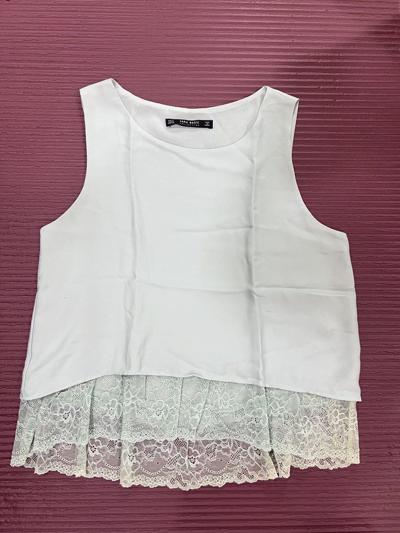 Zara Basic Sleeveless Tank Top with Lace Hem (Category: Sleeveless) located in Manila. Submitted by imprincessg888 (Listing ID 1465845367, Image 1). Description: - Brand: Zara Basic - Style: Sleeveless top with scoop neckline and relaxed fit - Detail: Beautiful floral lace panel at the bottom hem for added length and texture - Material: Lightweight and breathable, perfect for warm weather - Versatility: Easy to pair with your favorite jeans or sk