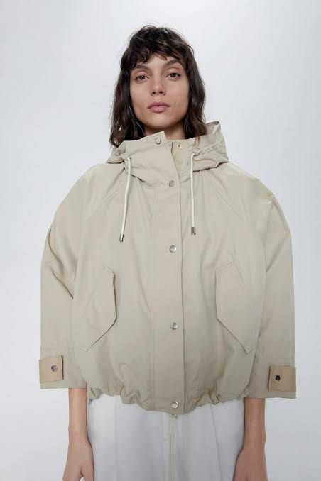 Zara Beige Hooded Utility Parka Jacket (Category: Coats, Jackets and Outerwear) located in Quezon City. Submitted by dropdeadprices (Listing ID 1465939213, Image 1). Description: - Color: Versatile beige - Fit: Relaxed, trendy oversized fit - Closure: Full zip front with snap button flap - Features: Funnel neck, Adjustable drawstrings at hood and hem, front flap pockets, and button cuffs - Material: Lightweight and ideal for rainy days or air-con