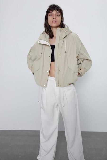 Zara Beige Hooded Utility Parka Jacket (Category: Coats, Jackets and Outerwear) located in Quezon City. Submitted by dropdeadprices (Listing ID 1465939213, Image 2). Description: - Color: Versatile beige - Fit: Relaxed, trendy oversized fit - Closure: Full zip front with snap button flap - Features: Funnel neck, Adjustable drawstrings at hood and hem, front flap pockets, and button cuffs - Material: Lightweight and ideal for rainy days or air-con