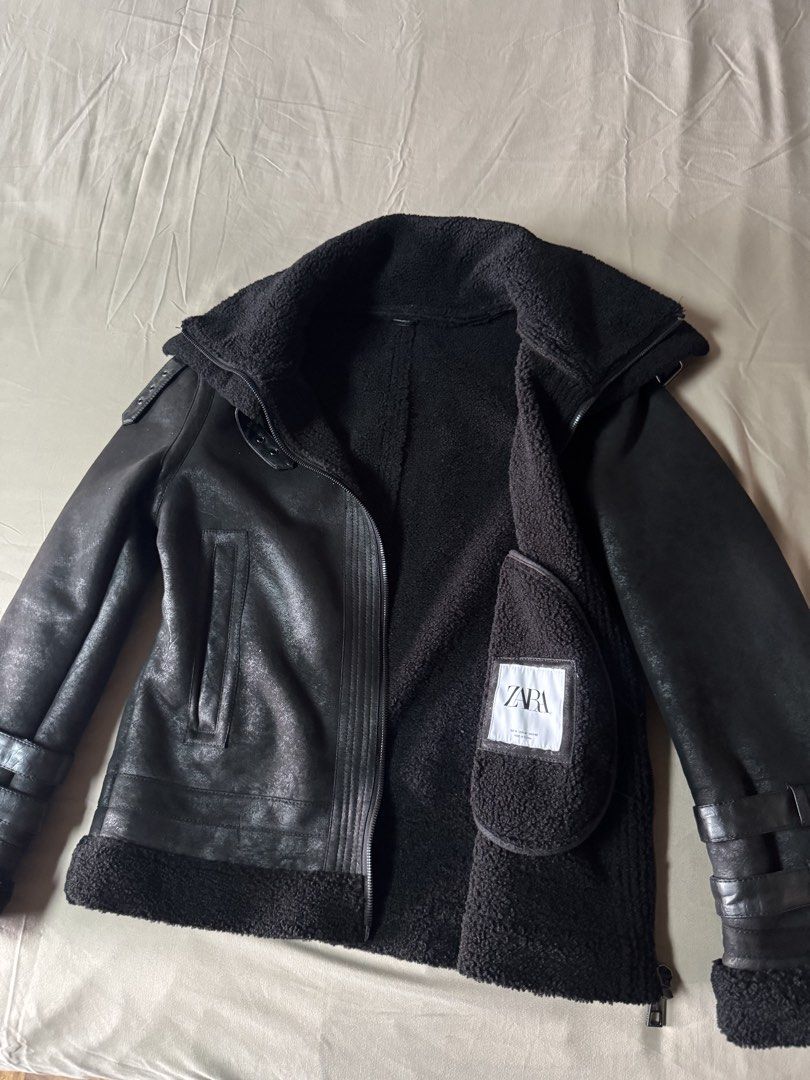 ZARA Black Faux Shearling Aviator Jacket (Category: Coats, Jackets and Outerwear) located in Manila. Submitted by seangoart (Listing ID 1465784759, Image 1). Description: - Brand: Zara - Style: Aviator jacket with wide lapel collar - Size: EUR M / USA M / MEX 40 - Color: Black - Material/Lining: Thick faux shearling lining (keeps you very warm in cold weather) - Closure & Pockets: Heavy-duty front zip closure with side welt pockets - Details: Dou