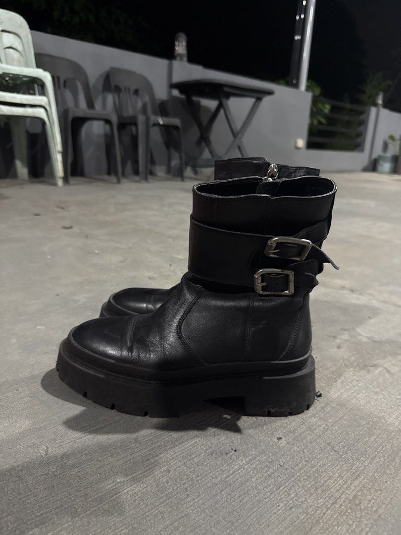 Zara Black real Leather Buckle Platform Boots (Category: Boots) located in Quezon City. Submitted by dropdeadprices (Listing ID 1465871691, Image 3). Description: - Brand/Model: Zara black leather platform boots - Size: EU 38 - Features: Double buckle ankle straps, chunky lug sole, and convenient side zipper closure - Condition: Pre-owned with normal leather creasing and minor scuffing on the soles - Perfect for adding an edgy vibe to any fall or