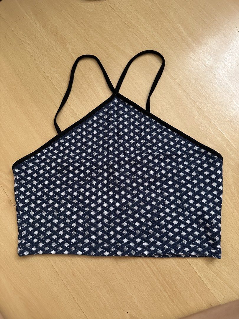 Zara Blue White Pattern Knit Crop Top Size L (Category: Sleeveless) located in Cavite. Submitted by _mariposa.mnl (Listing ID 1465833880, Image 1). Description: - Brand: Zara - Size: L - Color/Pattern: Navy blue and white geometric basketweave - Details: Black contrast trim on neckline and straps, thin criss-cross spaghetti straps in back - Perfect condition! Very flattering.
