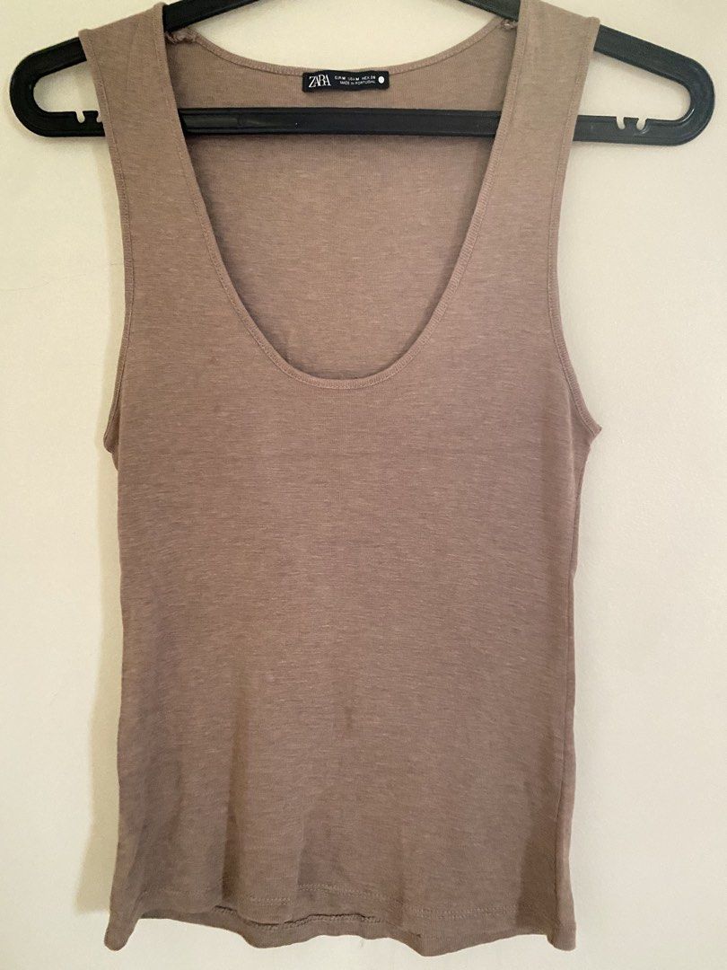 Zara Brown Scoop Neck Tank Top (Category: Sleeveless) located in Quezon City. Submitted by abssnf (Listing ID 1465858006, Image 1). Description: - Brand: Zara - Size: M - Color: Brown - Origin: Made in Portugal - Design: Classic scoop neck, lightweight and soft fabric - Styling: Perfect for layering or pairing with jeans and skirts for casual days.