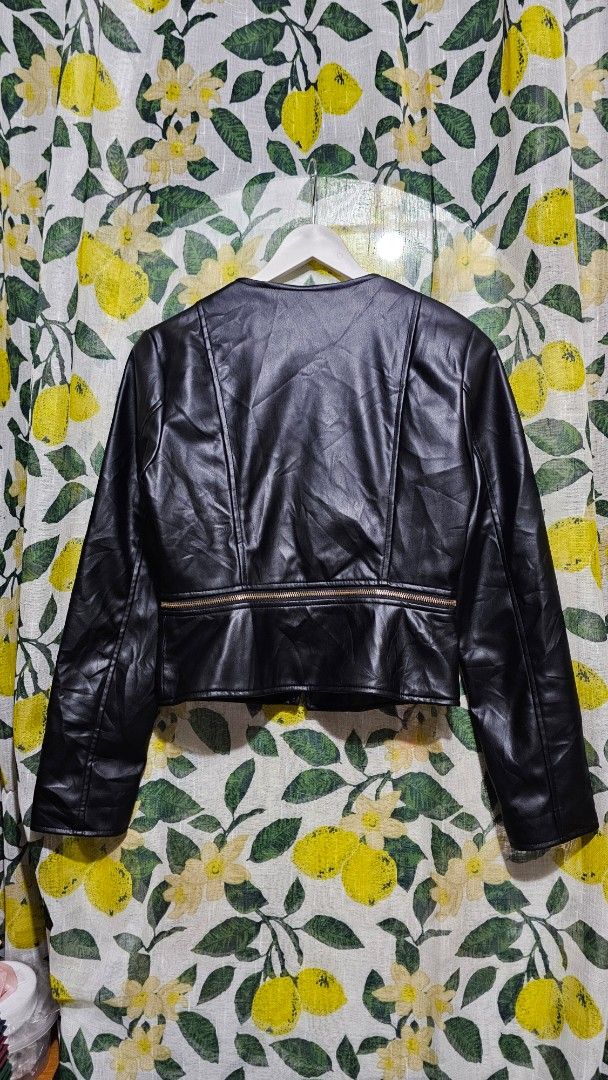 Zara Faux Leather Black Jacket (Category: Coats, Jackets and Outerwear) located in Kibawe. Submitted by Thrift_ni_Babac (Listing ID 1465876172, Image 2). Description: - Brand: Zara - Size: XS - Color: Black with chic gold hardware - Style: Cropped fit with zip closures and neckline button details - Condition: Pre-loved with an issue on one sleeve (as pictured) .