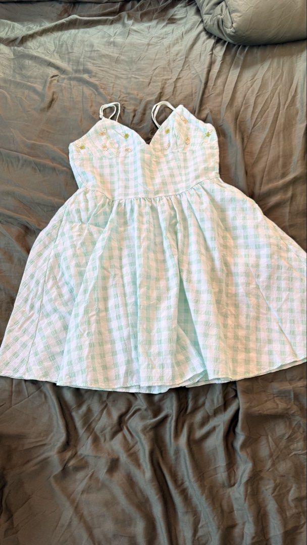 Zara Green Gingham Beaded Mini Dress (Category: Dresses) located in Batangas. Submitted by krieldre (Listing ID 1465776679, Image 1). Description: - Brand: Zara - Size: S - Style: Sleeveless mini dress with flouncy flared skirt and side zipper - Pattern: Green and white gingham seersucker fabric - Details: Cute beaded flower embellishments on the bust and adjustable thin straps - Condition: Excellent, great for warm weather.